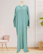 Load image into Gallery viewer, SEA GREEN CRUSHED ABAYA WITH CROSS PINTUCKS ON CF AND FABRIC BUTTONS ON SIDES
